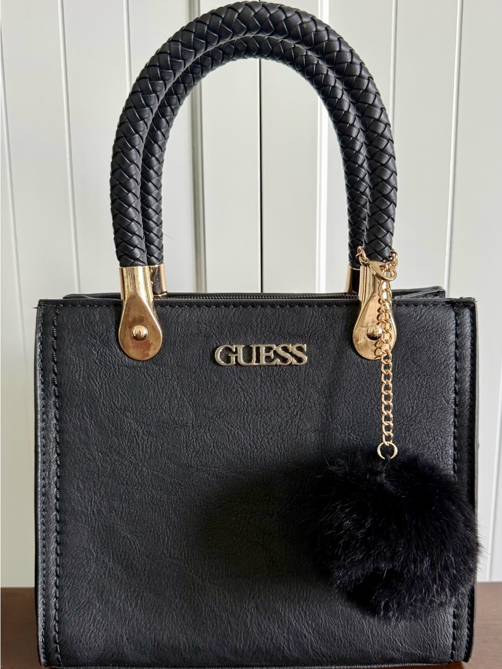 GUESS Black Top-Handle Satchel Bag Purse Gold Hardware and Pom Pom Charm Zip Top